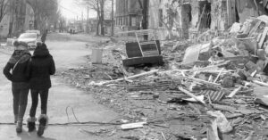 A street with debris and trash on the ground.