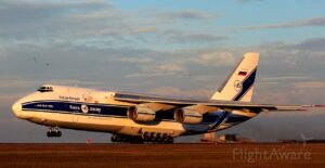 A large airplane sitting on top of an airport runway.