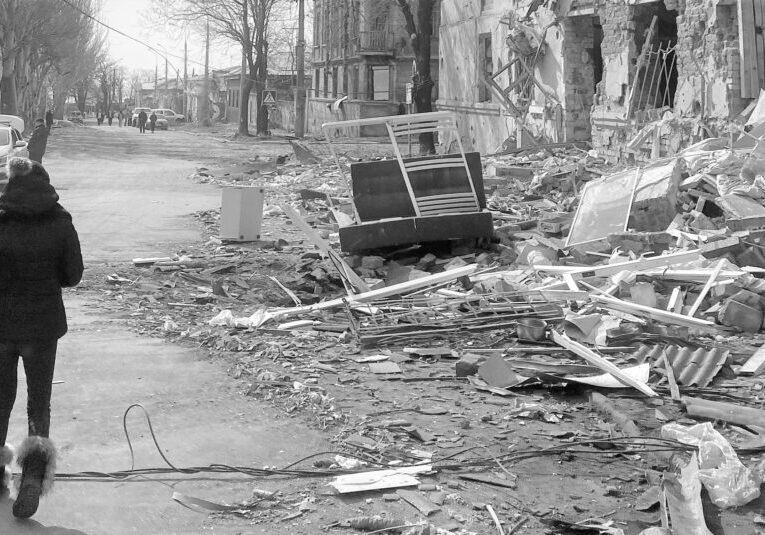 A street with debris and trash on the ground.